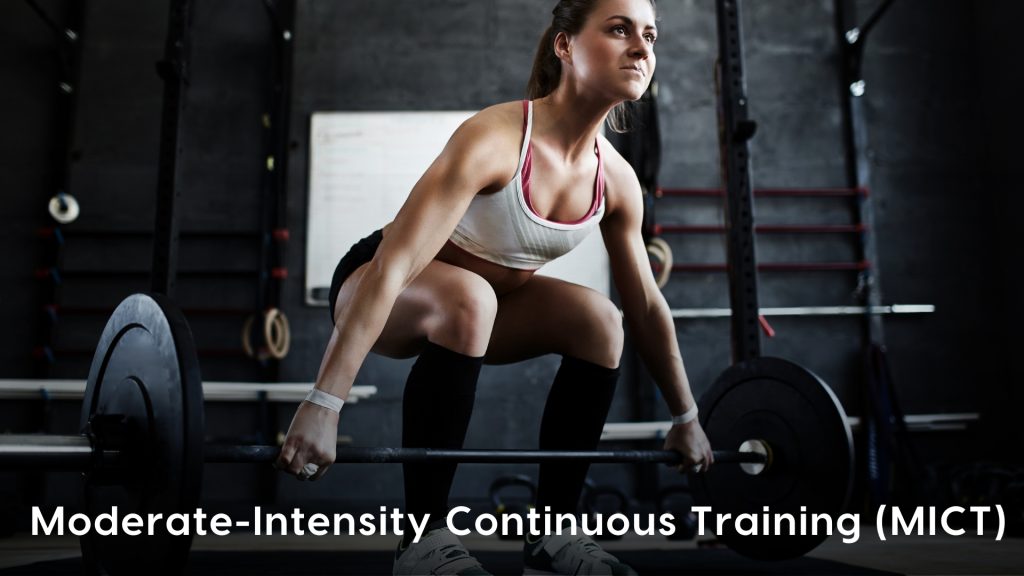 Moderate-Intensity Continuous Training (MICT) workout featuring a fit woman performing a barbell deadlift in a gym. MICT involves sustained, steady-paced exercise at a moderate intensity, improving endurance, muscle strength, and cardiovascular fitness. This type of training is effective for building stamina and overall conditioning.